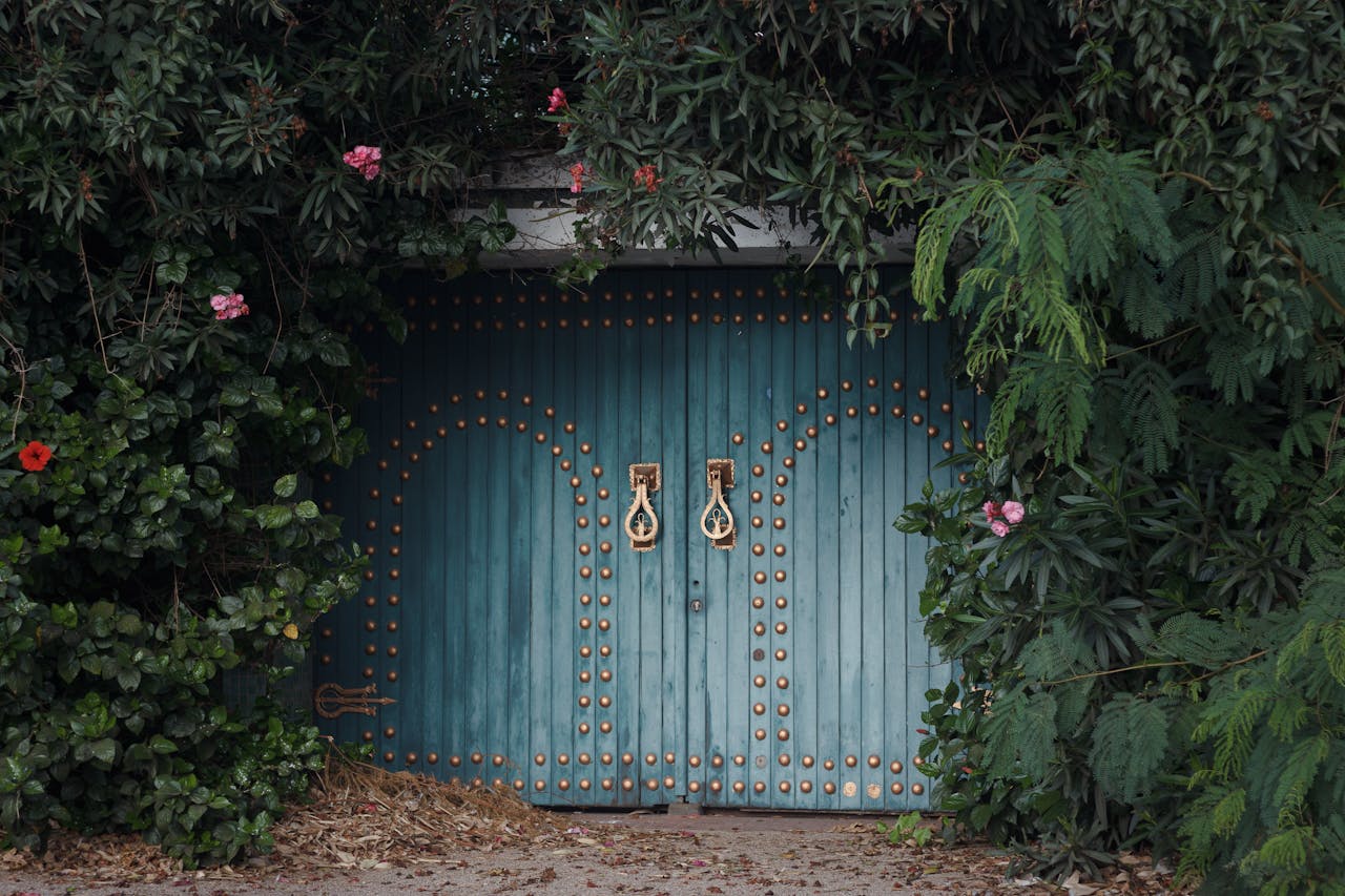 charming-wooden-gate-surrounded-by-lush-greenery-34680712
